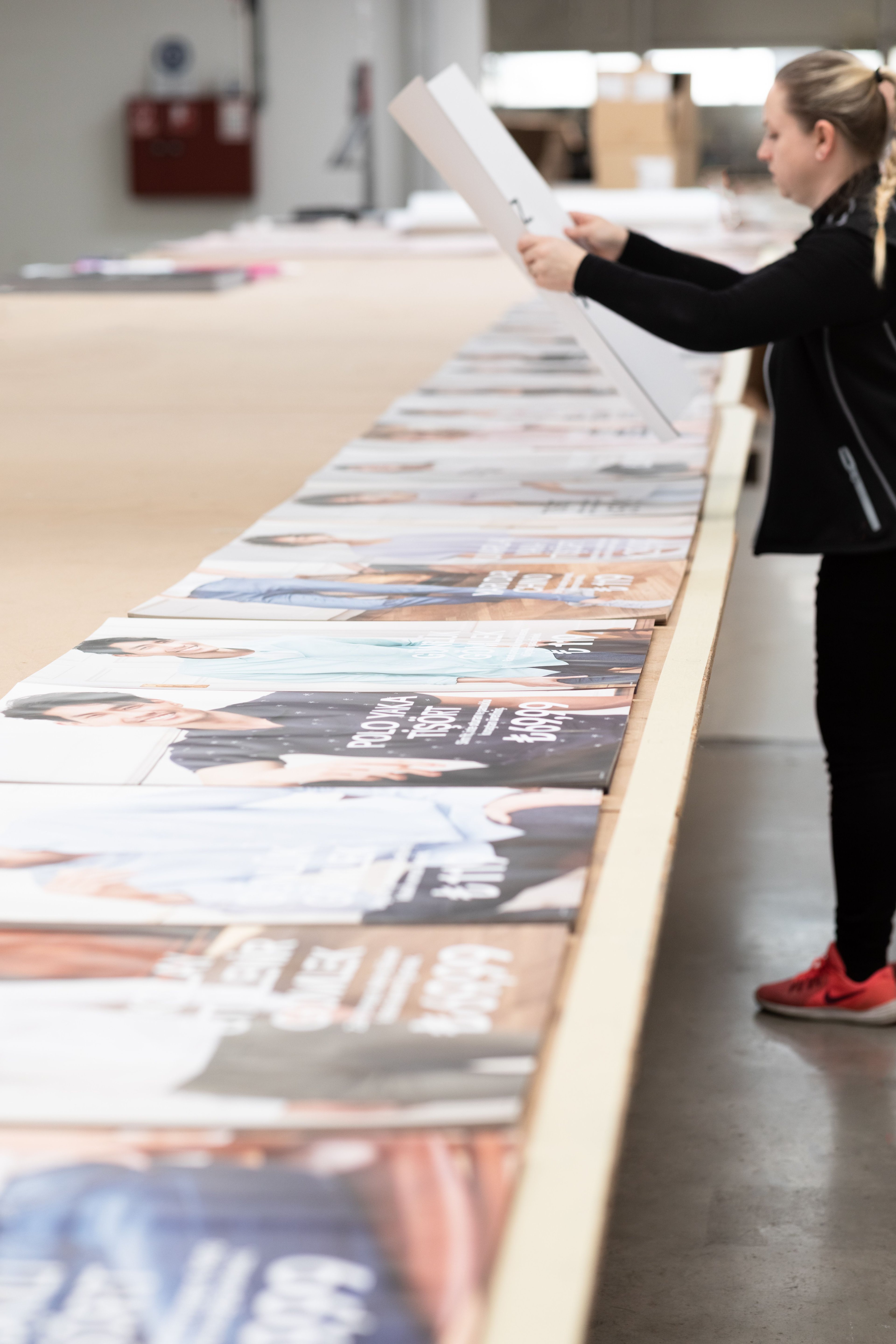 ARIAN team member packing posters