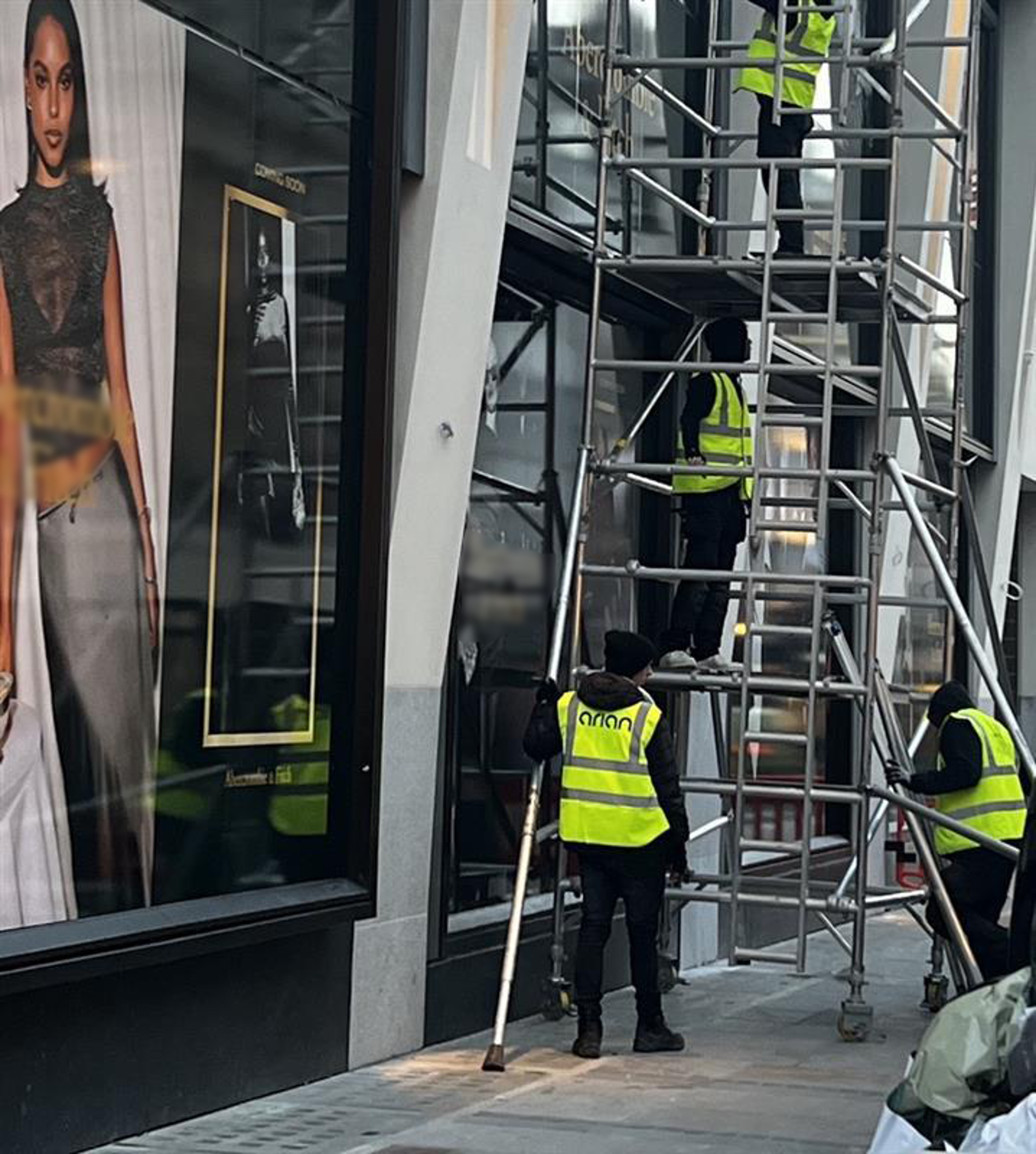 ARIAN installation team at work in front of store